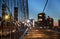 Blurred urban traffic Brooklyn Bridge at twilight in New York City background scene at night