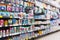 Blurred variety of Baby milk bottles and Baby accessories  on shelves at grocery store supermarket