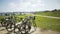 Blurred video background of bicycles in a sunny park by the oceanside