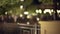 Blurred video background plate of urban park illuminated by street lamps