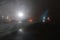 Blurred View from airplane Window at foggy night in airport