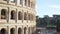 Blurred view of ancient Colosseum during the day in Rome Italy