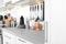 Blurred view of different appliances, clean dishes and utensils