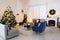 Blurred view of festively decorated room with Christmas tree and furniture