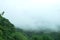 Blurred view of mountain cover by cloud
