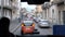 Blurred view of slow traffic in Italian street in the evening