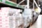 Blurred view of storage stands with different building materials in wholesale warehouse