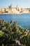 Blurred view of Valletta as seen from Tigne point in Sliema, late afternoon warm light