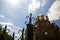 Blurred view on the wooden cathedral and sky from behind the fence