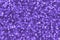 Blurred violet decorative sequins. Background image with shiny bokeh lights from small elements