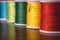 Blurred vivid colors threads bobbins spools, industrial sewing concept design