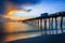 Blurred water softens as the sun sets over Venice Pier in Florida