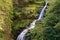 Blurred water of waterfall of Kamienczyk river in Poland