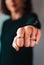 Blurred woman standing over punching fist. Selective focus.
