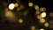 Blurred yellow Christmas bokeh illumination in defocus. Abstract particles background