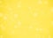 Blurred yellow texture background with white dotted pattern. Yellow bright color background.