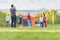 Blurred young children football players running in park