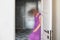 On a blurry background in motion, the indistinct silhouette of a girl in a purple dress. Depression