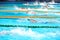 Blurry background of splash drop water on swimming race