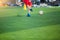 Blurry ball after boy soccer player speed run on green artificial turf to shoot it to goal. boy soccer player training