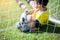 Blurry of ball in hand of goalkeeper on green grass at goal. Goalkeeper is catching the soccer ball. Asian boy soccer player