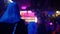 Blurry with bright background: People partying and clubbing at a nightclub