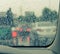 Blurry car seen through wet windscreen in rainy day