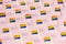 Blurry close-up focus on Rainbow LGBTQ flags pattern. June the gay pride month symbol concept.  on pastel pink background