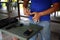 Blurry closeup a man hands holding and loading 9mm bullets in the pistol at the shooting range, is used for testing practice with