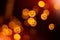 Blurry defocused bokeh lights with pumpkin faces.