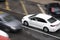 Blurry driving cars on the street hit by the heavy rain with hail