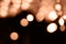 Blurry garland lights on a dark background. Festive Christmas and New Year background. Soft focus. Image toned in color