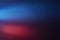 Blurry glow bright red and blue light beam on a dark background