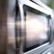 A blurry image of a microwave oven, AI