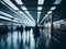 A blurry image of people walking through a subway station.