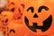 A blurry Jack o`lantern or halloween pumpkins with antique old film camera effect