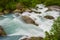 Blurry motions water of river which is located near path to the Briksdalsbreen Briksdal glacier. Jostedalsbreen National Park.