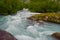 Blurry motions water of river which is located near path to the Briksdalsbreen Briksdal glacier. Jostedalsbreen National Park.