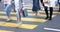 Blurry people on yellow zebra crossing