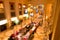 Blurry shot of a elegant grand hall with multiple luxurious tables adorned with lights