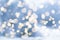 Blurry snowy winter christmas background with circular bokeh lights