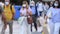 Blurry video of people crossing the street  wearing protective mask