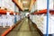 Blurry warehouse interior with shelves, boxes and document