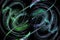 Blurry wavy blue and green lines create swirls against a black background. Abstract fractal background. 3d