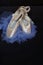 Blush ballet Pointe shoes with blue tutu on black