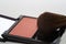 Blusher in a cosmetics compact