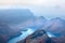 Blyde River Canyon blue lake and mountains in the clouds background, South Africa