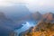 Blyde River Canyon blue lake and mountains in the clouds in sunset light background, South Africa