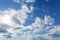 Blye sky with white fluffy clouds background