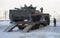 BMP-3 (infantry fighting vehicle) drives onto a trailer, winter snowy morning